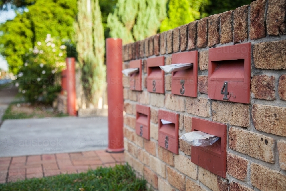Urban mailboxes in brick wall - Australian Stock Image