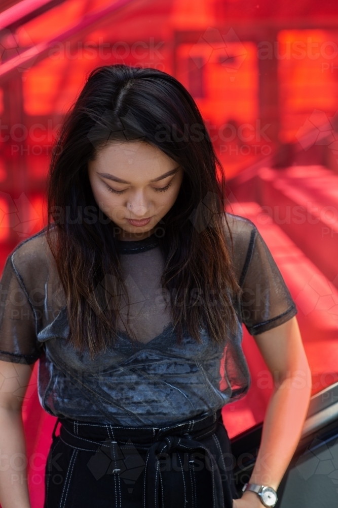 urban portrait of young Asian woman - Australian Stock Image