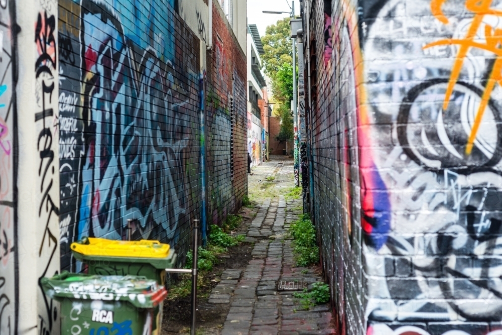 urban street scene, alley with graffiti and wheelie bin - Australian Stock Image
