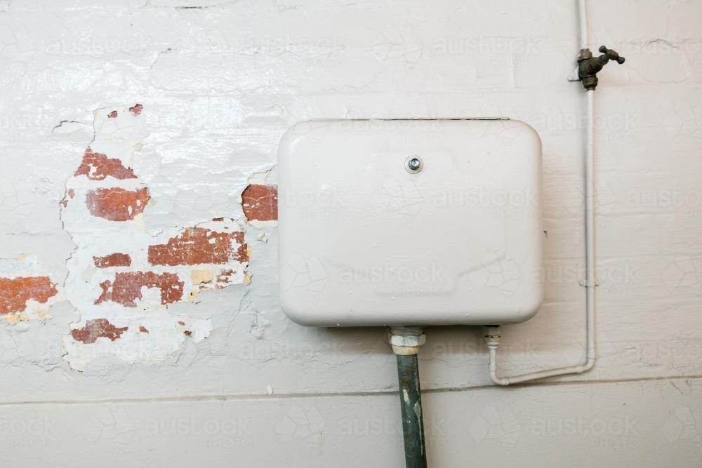 Urinal Cistern in an old Public Toilet - Australian Stock Image