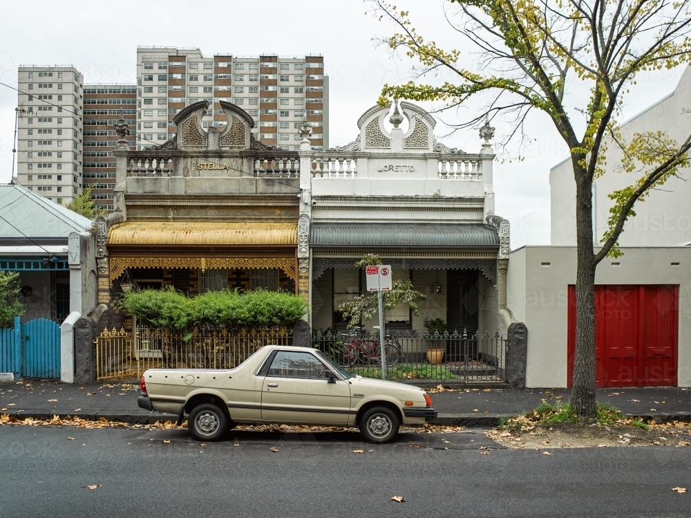 Ute parked on street in front of terrace houses - Australian Stock Image