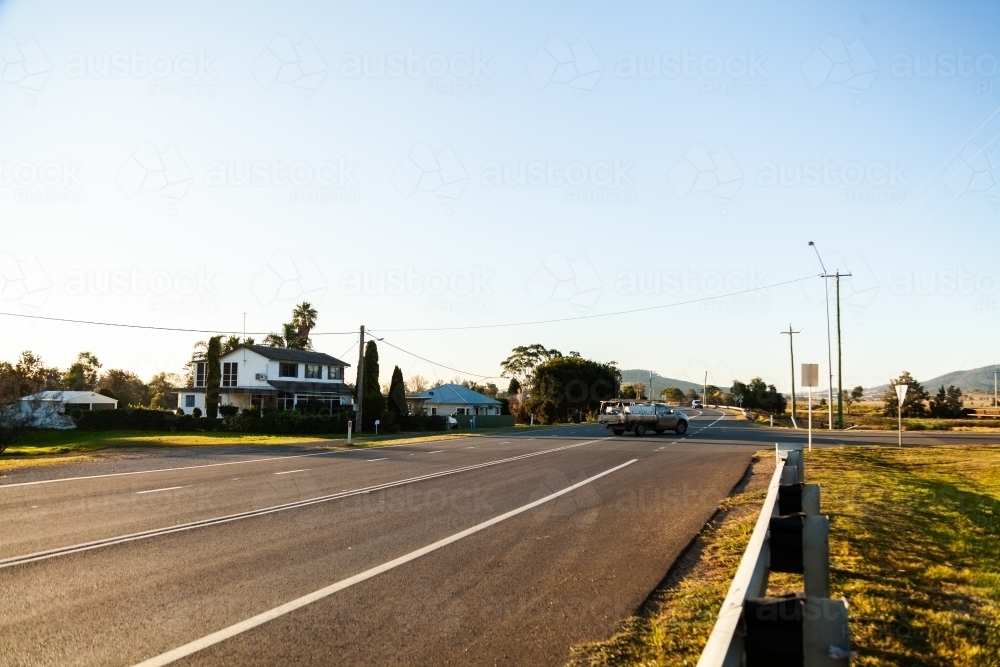 Ute turning across traffic on road right hand turn - Australian Stock Image