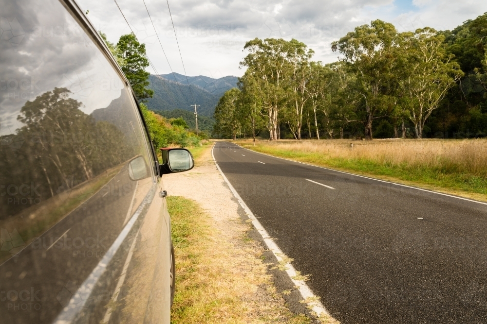 van by the side of road with copyspace - Australian Stock Image