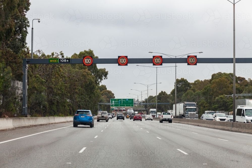 Image of variable speed signs showing limit of 100 over road with ...