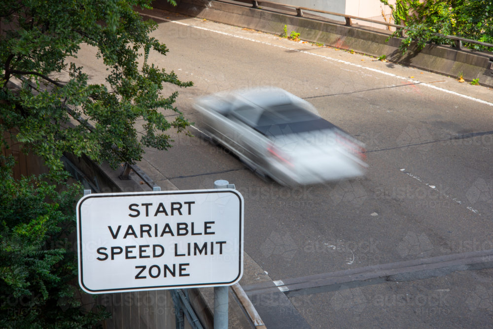 Variable speed zone sign with car driving past - Australian Stock Image