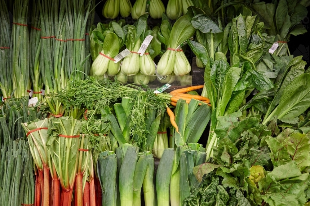 Various green vegetables on supermarket shelf - Australian Stock Image
