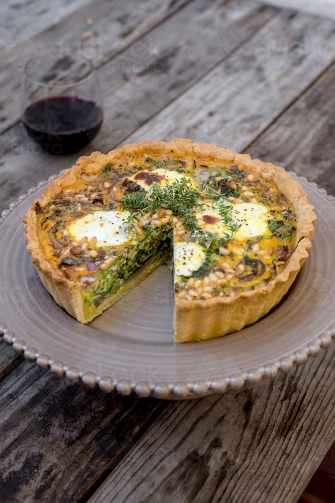 vegetable tart with goats curd, with red wine - Australian Stock Image