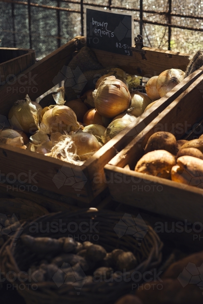 Vegetables in a crate at a farm stall - Australian Stock Image