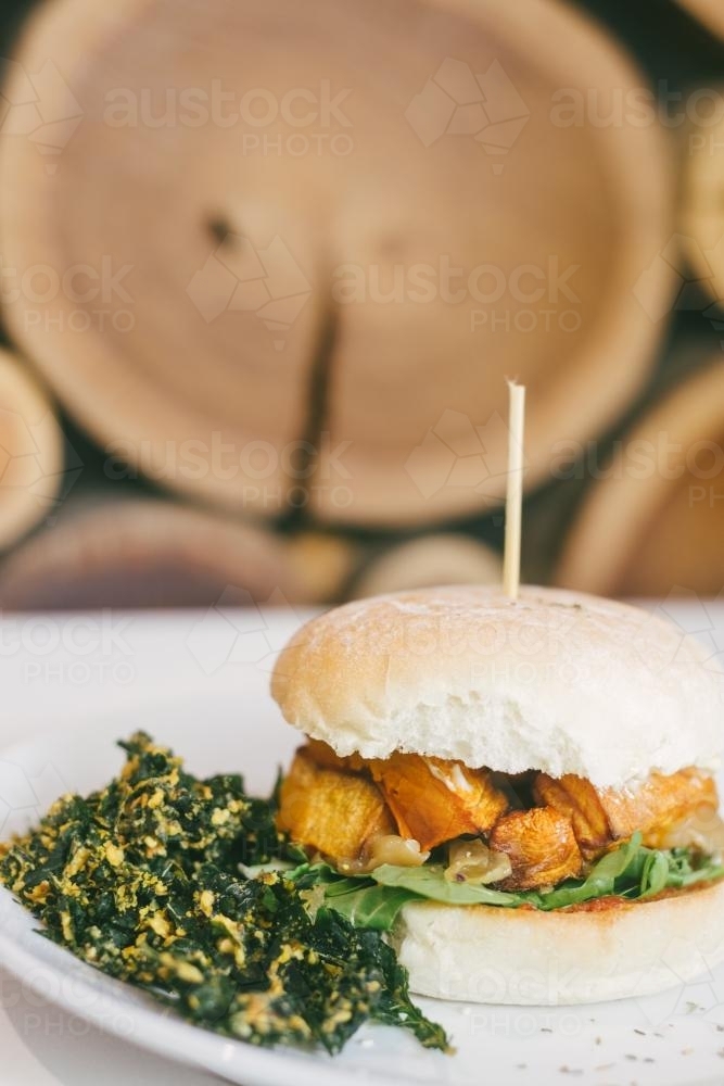 vegetarian burger with fried kale - Australian Stock Image