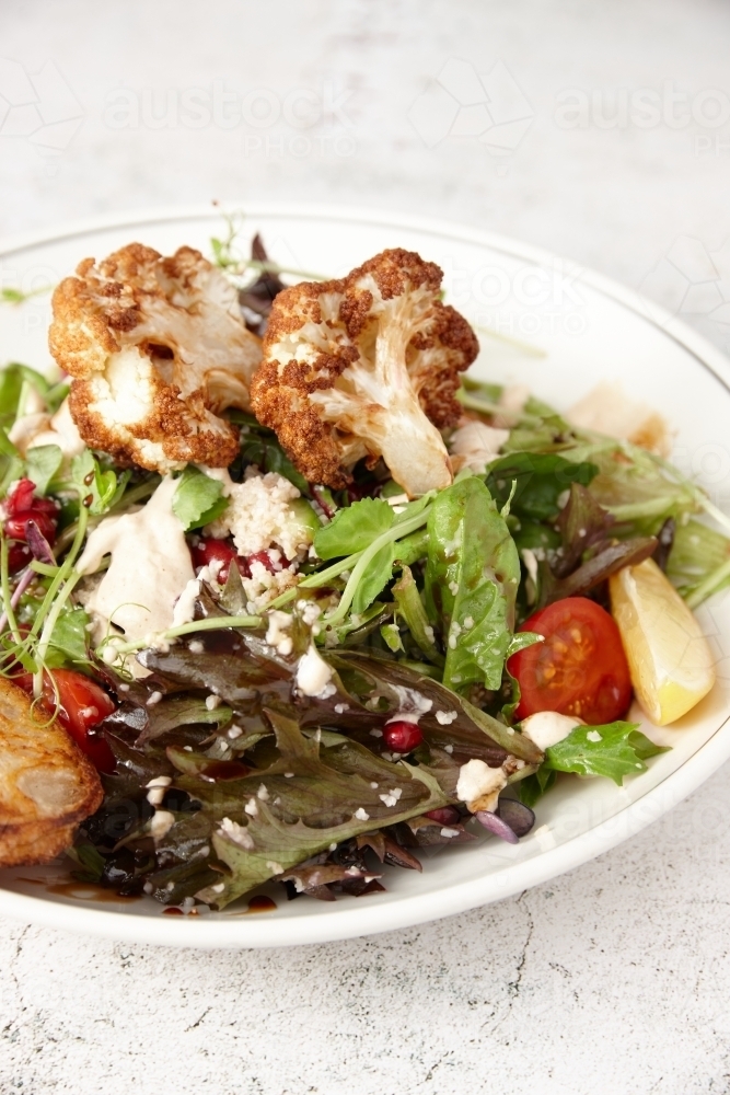 Vegetarian cauliflower salad in bowl - Australian Stock Image