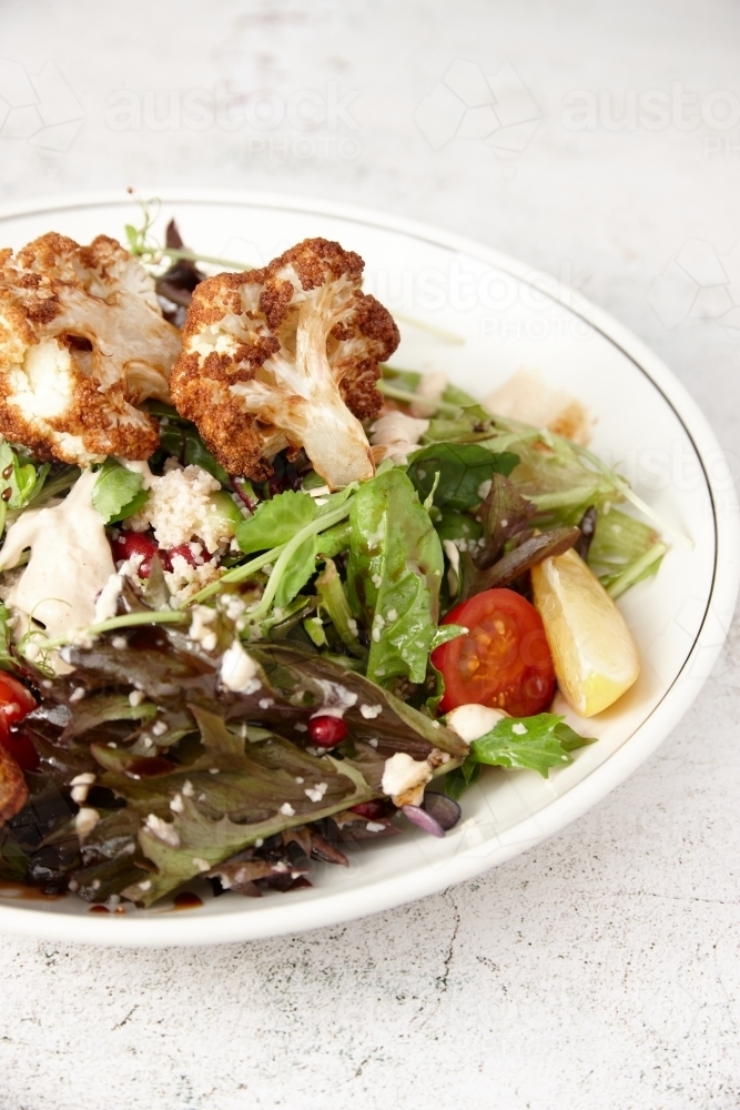 Vegetarian cauliflower salad in bowl - Australian Stock Image