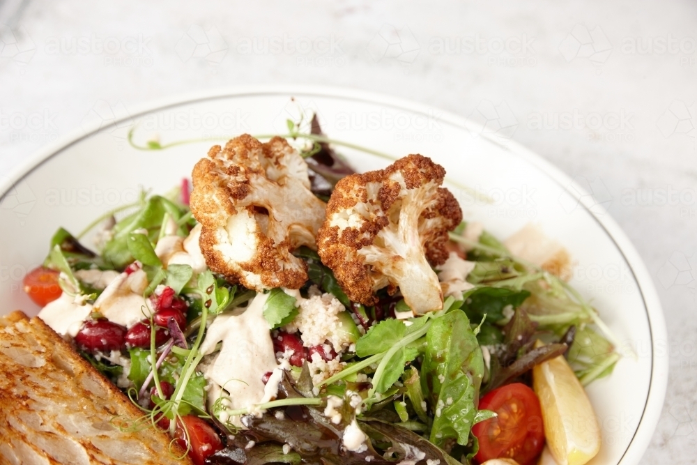 Vegetarian cauliflower salad in bowl - Australian Stock Image