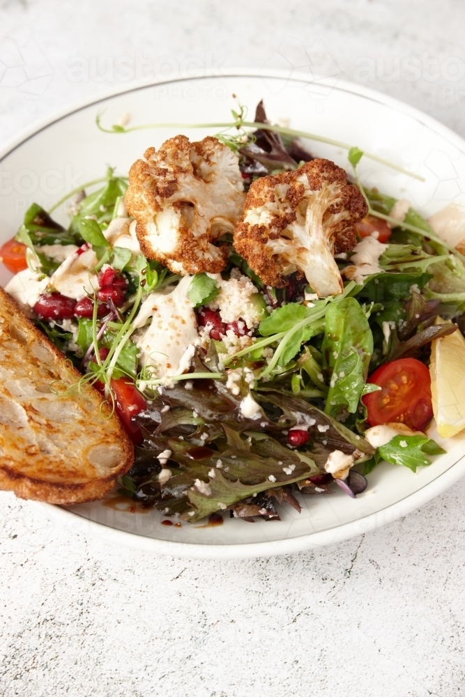 Vegetarian cauliflower salad in bowl - Australian Stock Image