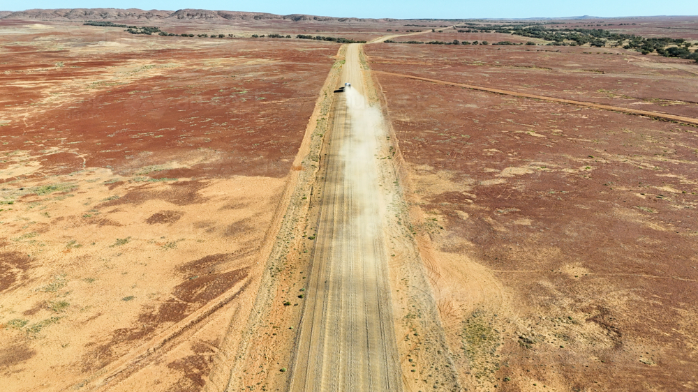 Vehicle driving along outback road - Australian Stock Image