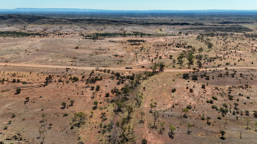 Vehicle parked in the middle of an outback dirt road - Australian Stock Image