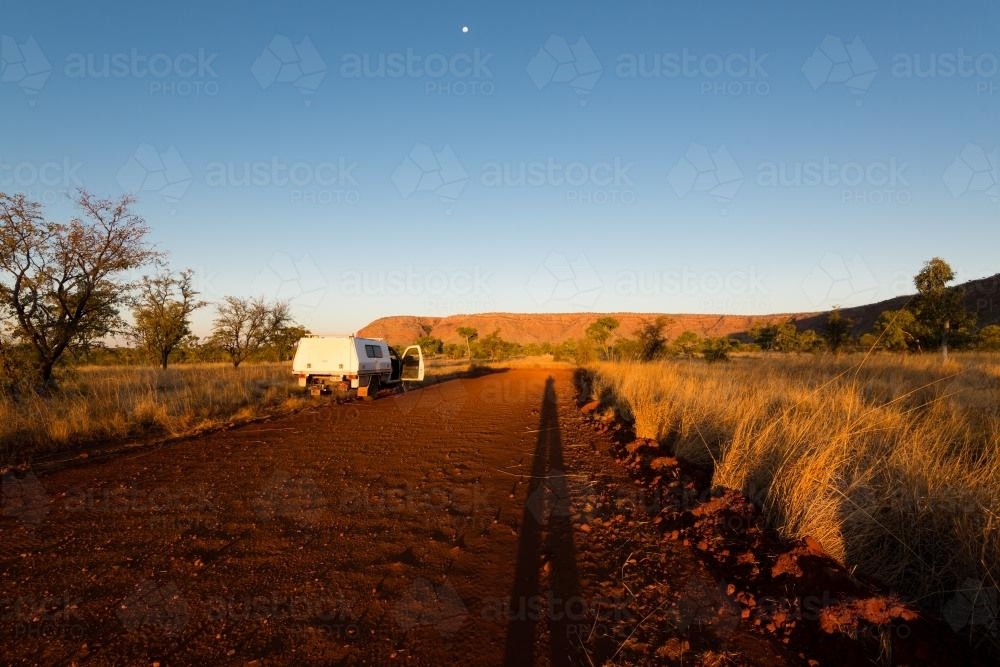 Vehicle parked on remote dirt road in late afternoon light - Australian Stock Image