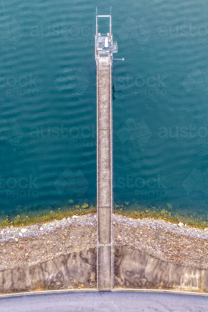 Vertical Aerial downward view of the Glenbawn Dam wall with the walkway and water intake - Australian Stock Image