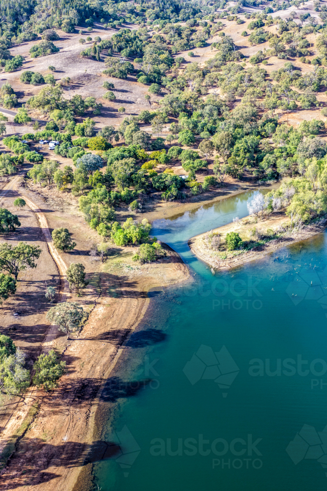 Vertical Aerial view of Glenbawn Dam and camping areas along the shoreline - Australian Stock Image