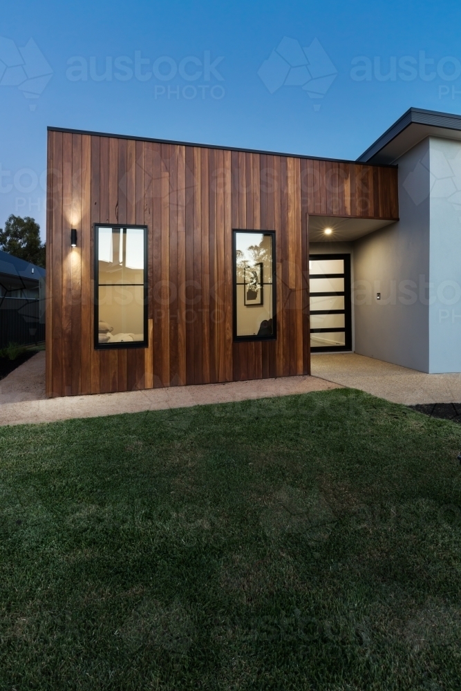 Vertical contemporary new home with wood cladding detail - Australian Stock Image