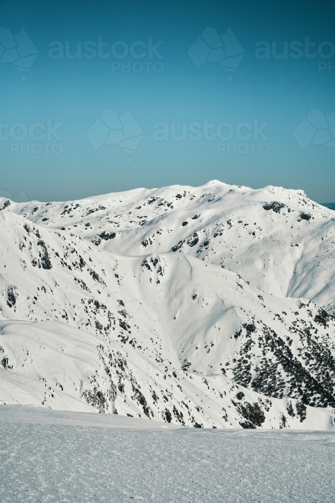 vertical mountain vista looking over Snowy Mountains Main Range - Australian Stock Image