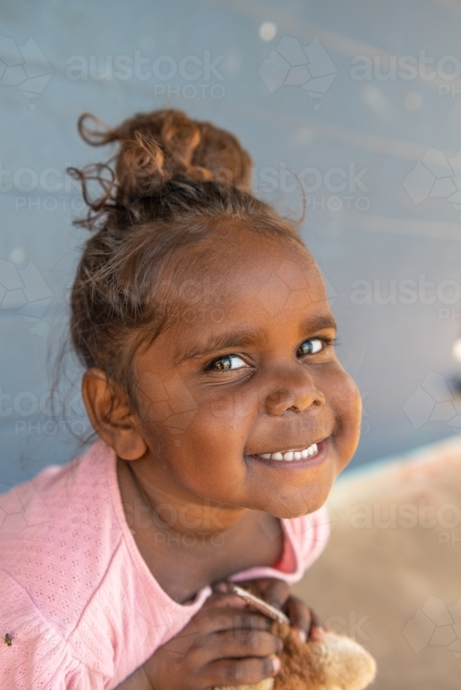 Vertical shot of 3 year old Aboriginal girl - Australian Stock Image