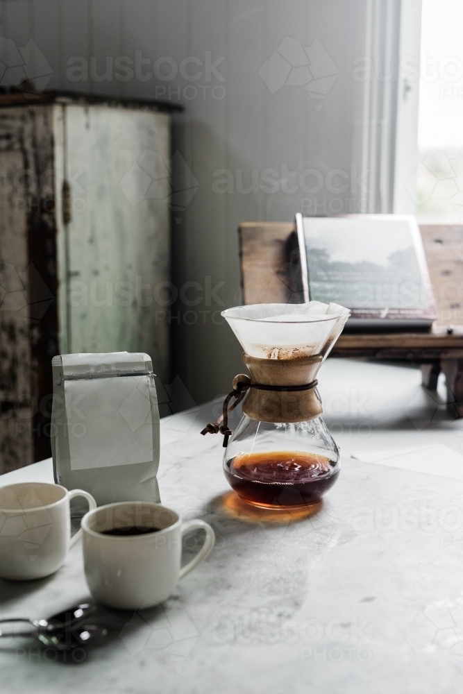 Vertical shot of a coffee dripper making two cups of coffee - Australian Stock Image