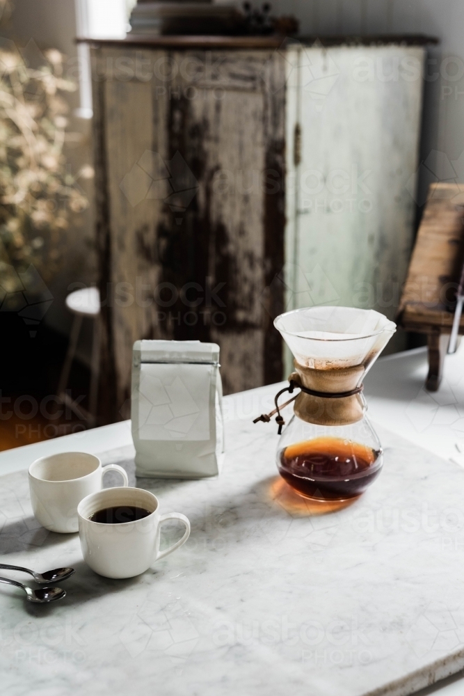 Vertical shot of a coffee dripper making two cups of coffee - Australian Stock Image