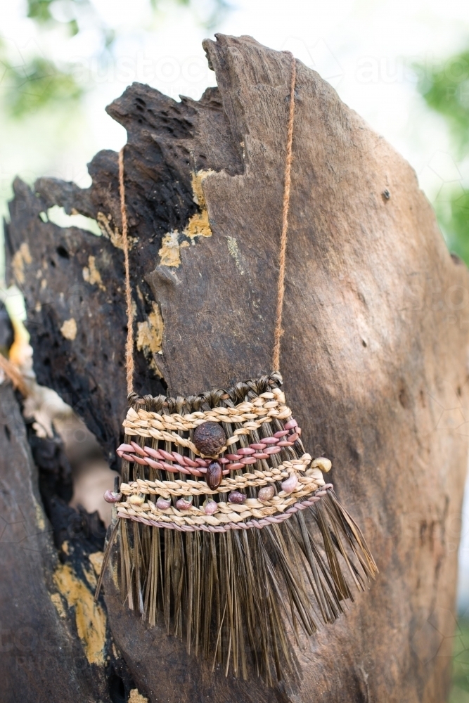 Vertical shot of a handmade rustic necklace - Australian Stock Image