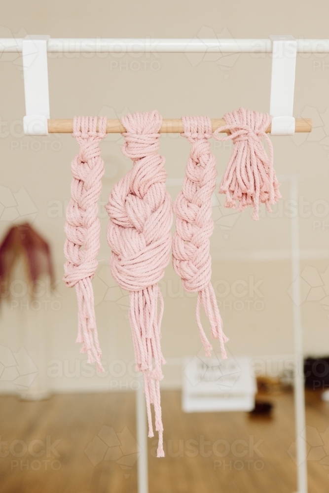 Vertical shot of braided hanging yarn - Australian Stock Image