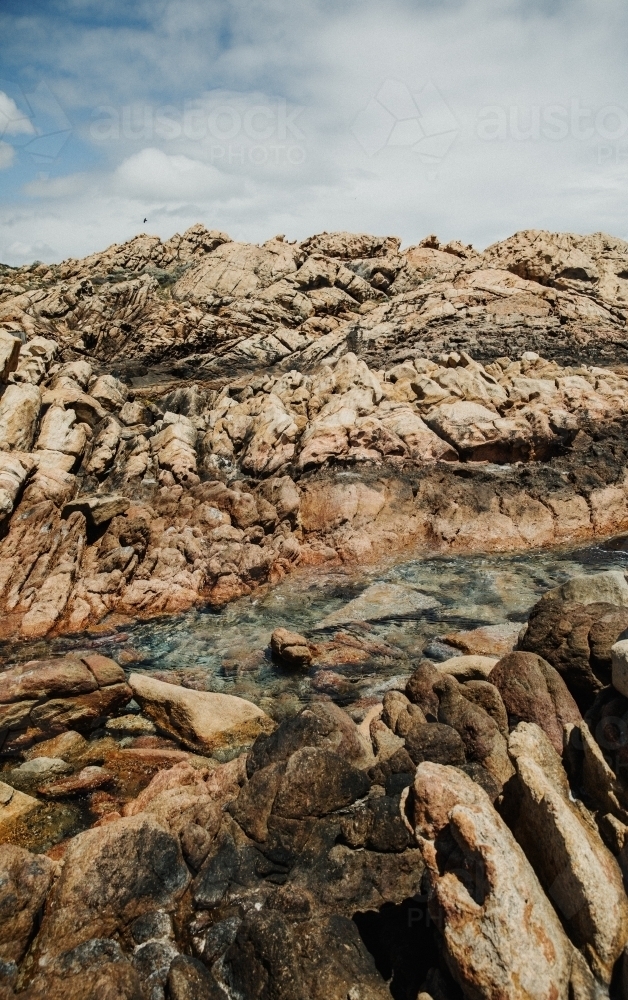 Vertical shot of coastal rock fragments - Australian Stock Image