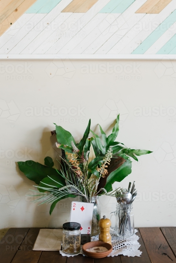 Vertical shot of greenery display on café table - Australian Stock Image