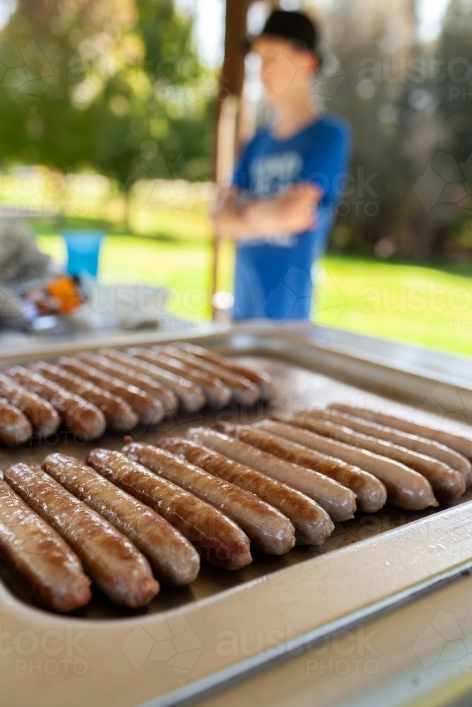 Vertical shot of sausages on park barbie - bbq meat - Australian Stock Image