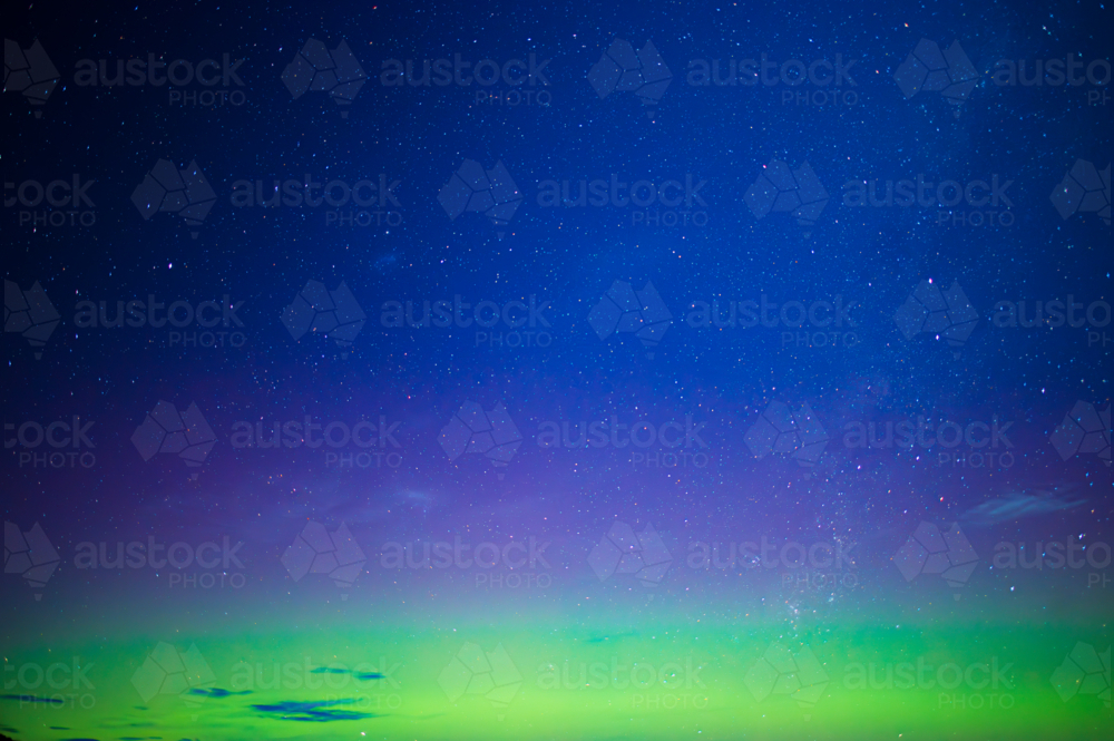 vibrant green and purple aurora night sky - Australian Stock Image