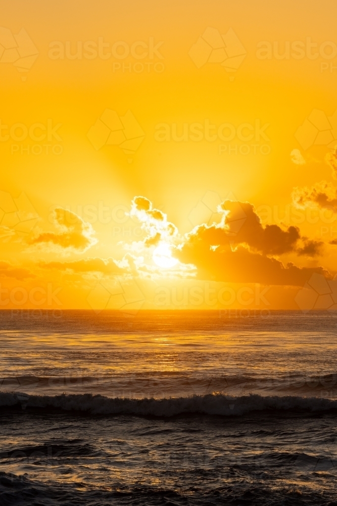 Image of Vibrant yellow sunrise over the ocean at Brunswick Heads, NSW ...