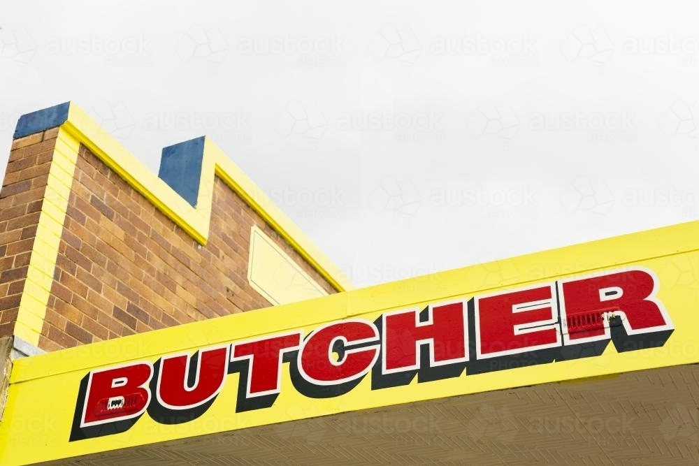 Vibrantly coloured small business butcher sign. - Australian Stock Image