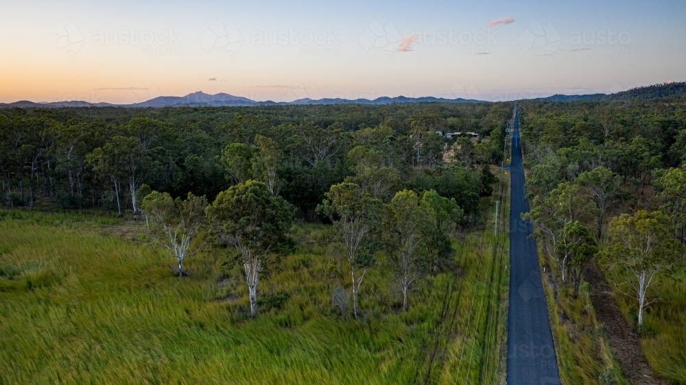 View above Schilling Lane, Calliope, with Mount Larcom in the background. - Australian Stock Image