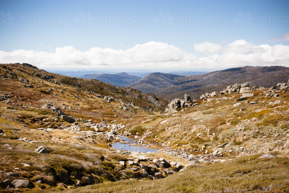 view across the valleys on the Kosciuszko walk near the summit of Thredbo in Snowy Mountains - Australian Stock Image