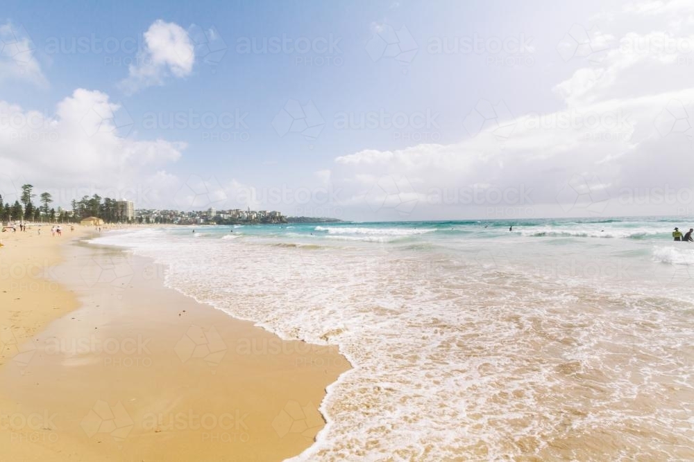 View along Manly beach on a sunny day - Australian Stock Image