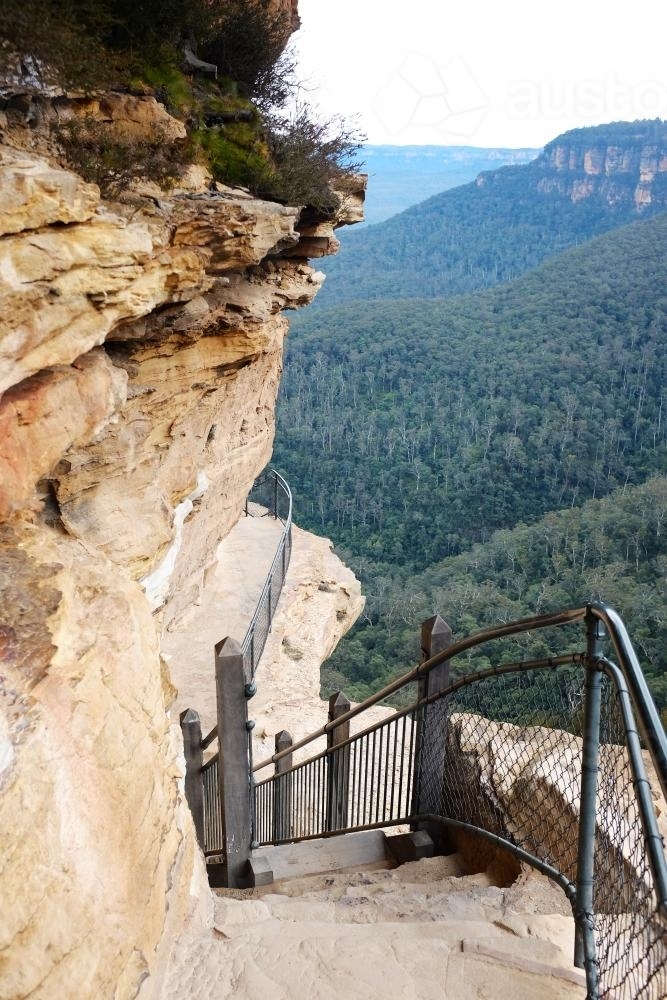 View down a rocky, elevated walking path in the Blue Mountains - Australian Stock Image