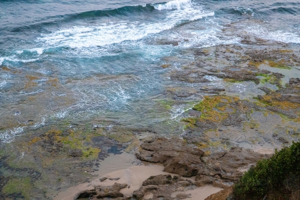 View down to rocky shelves along coastline - Australian Stock Image