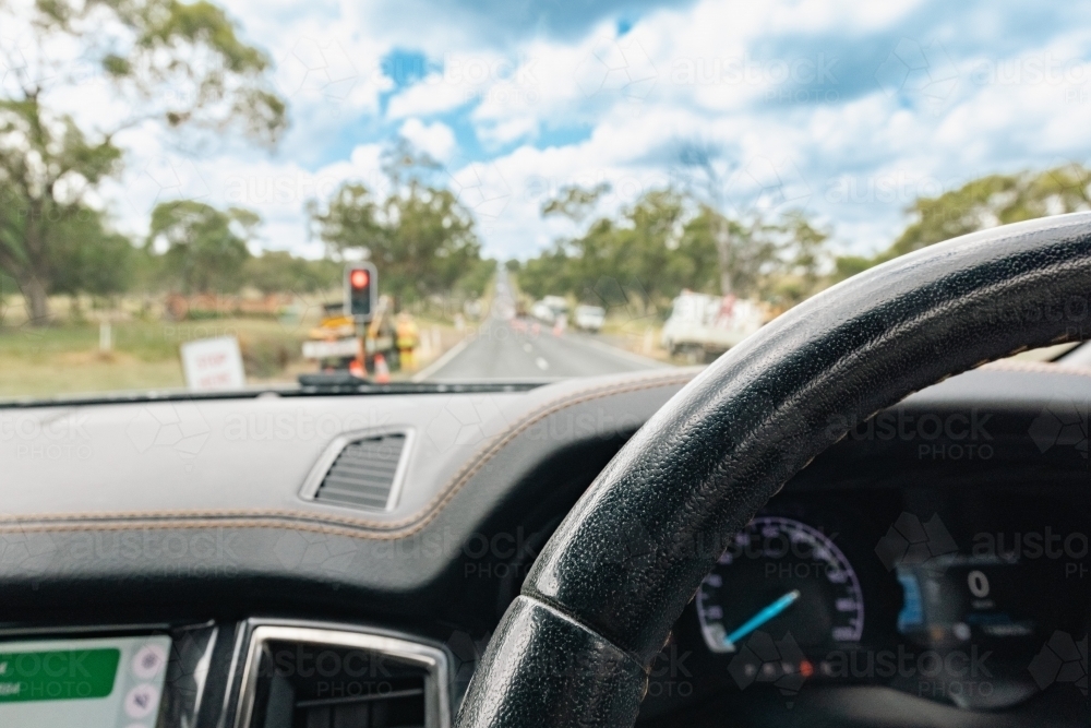 Image of View from inside vehicle stopped at red light at roadworks in ...