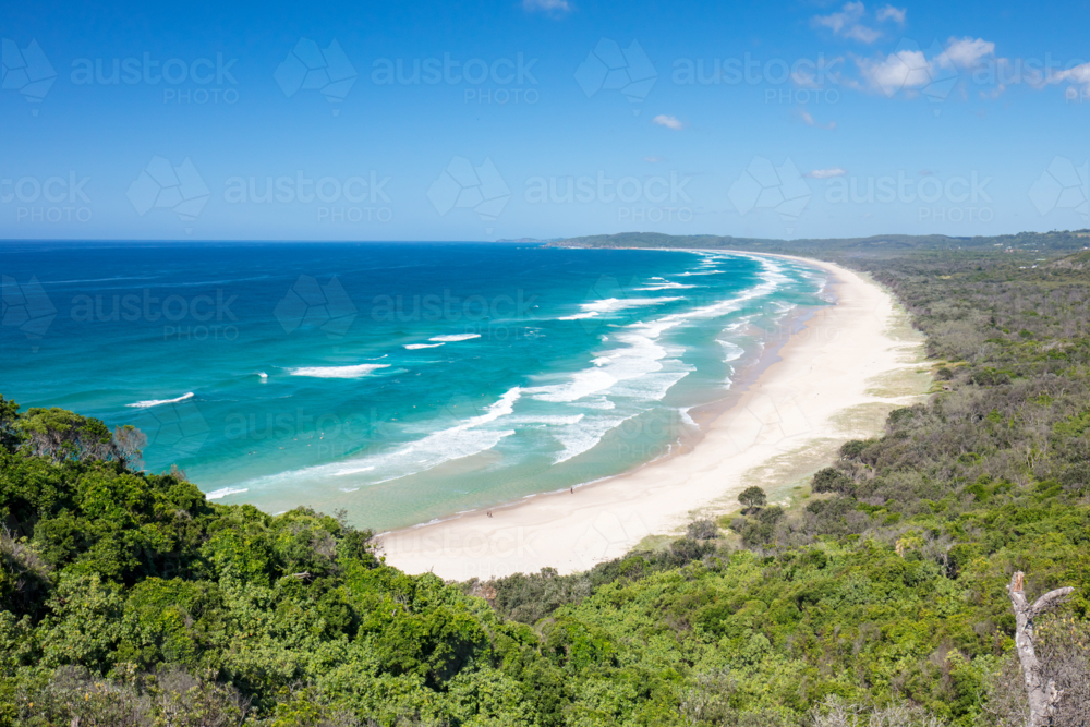 view from Lighthouse Rd over Tallows Beach and Cape Byron in Byron Bay, New South Wales - Australian Stock Image