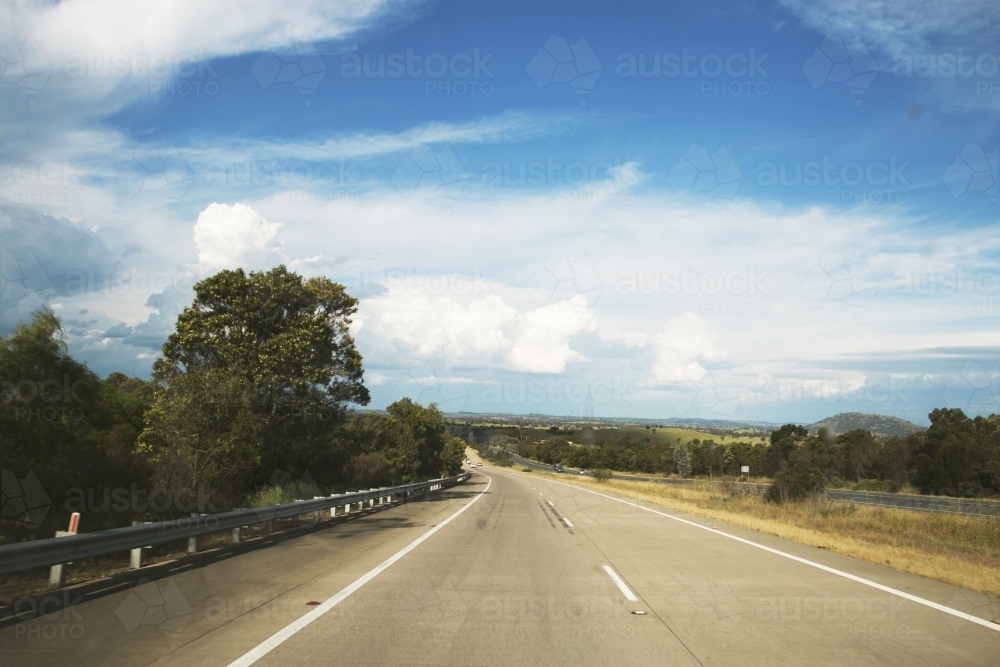 View from out the front of a car, of highway in country area - Australian Stock Image
