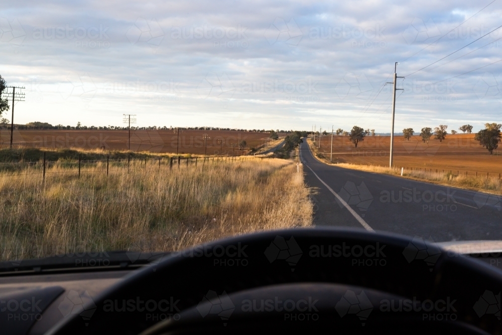 View from the interior of a car onto a country road - Australian Stock Image