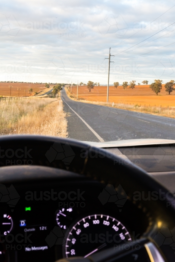 View from the interior of a car onto a country road - Australian Stock Image
