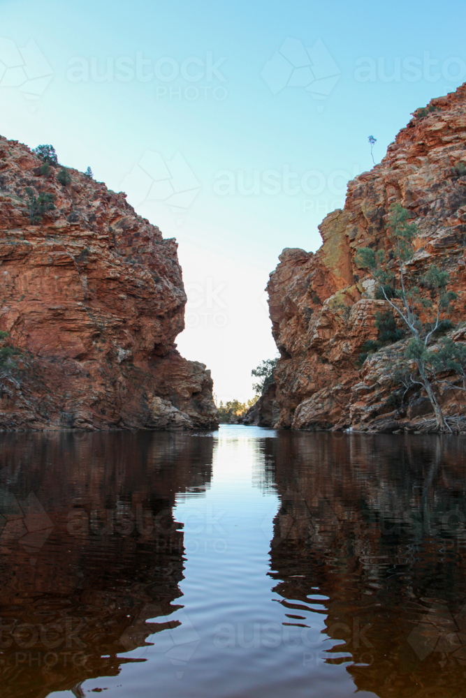 View looking down the rocky gap at a remote swimming hole - Australian Stock Image