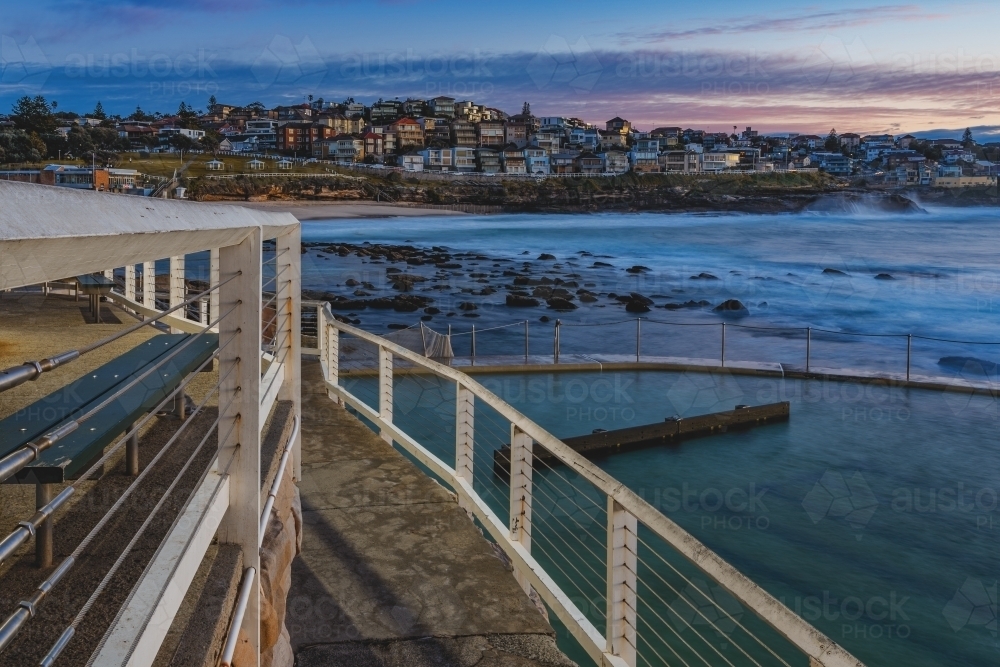 View of a beach and city on a house deck - Australian Stock Image