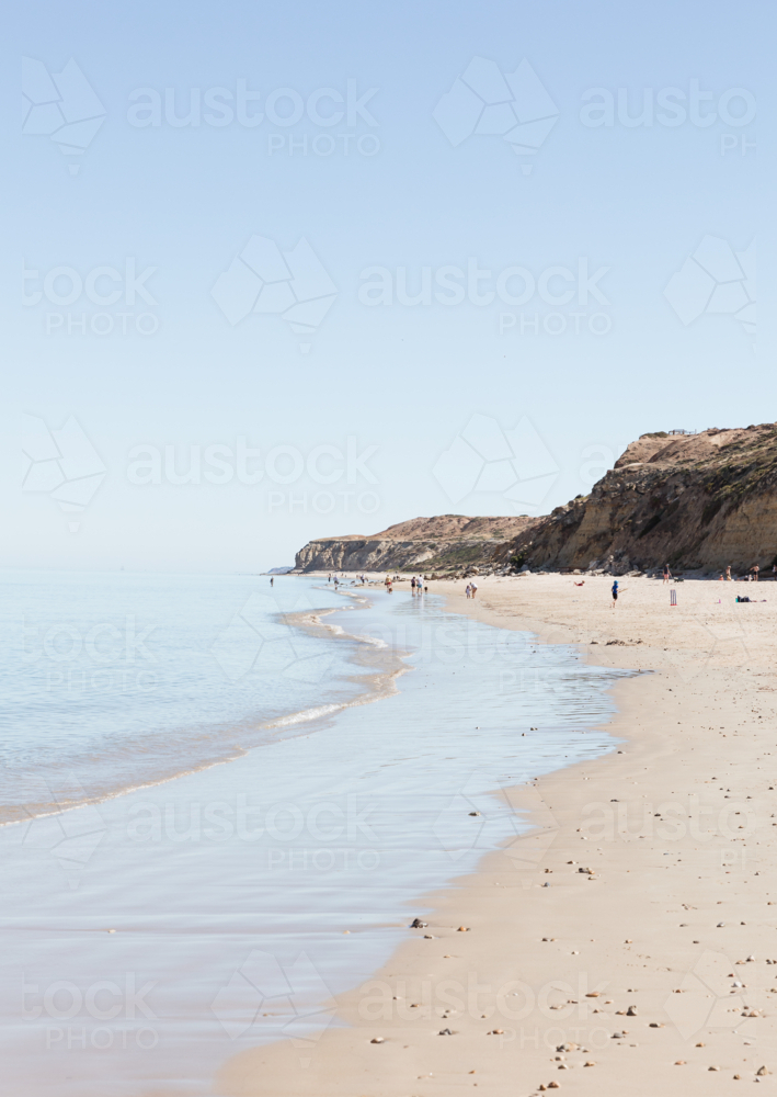 View of beach and cliffs along Port Willunga Beach, South Australia on bright day - Australian Stock Image