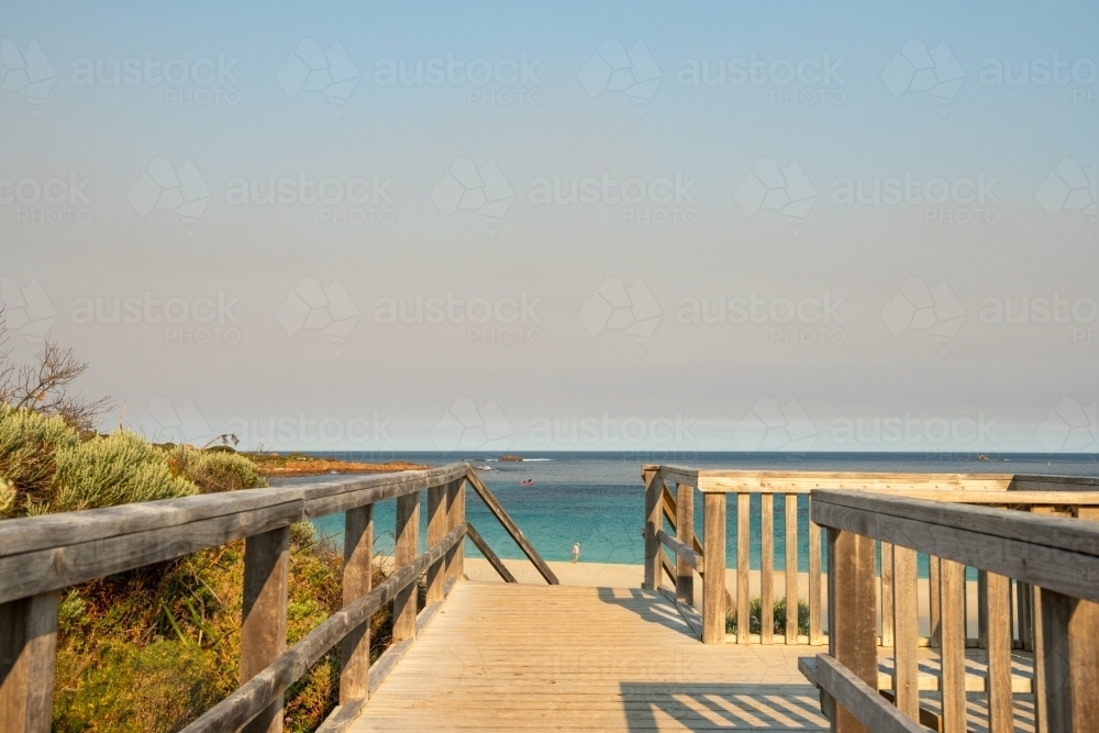 View of beach and ocean from an upper boardwalk - Australian Stock Image