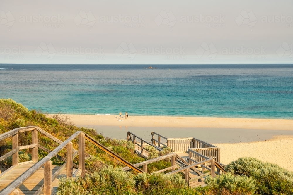 View of beach and ocean from top of staircase - Australian Stock Image